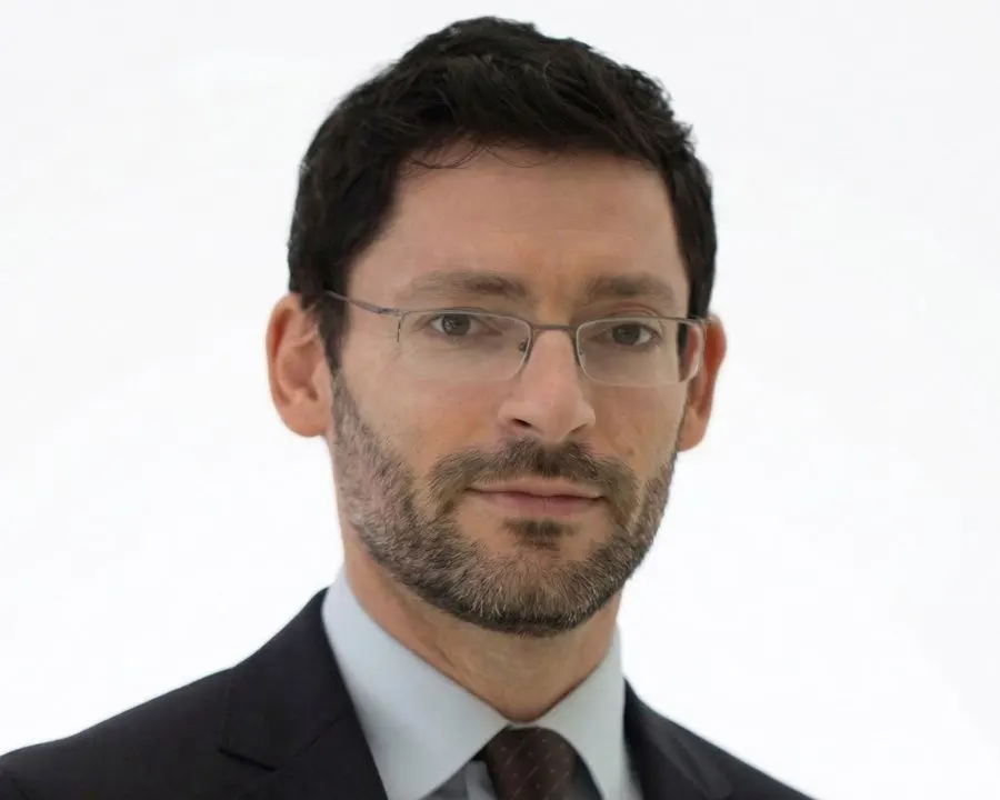 Man with glasses smiling
