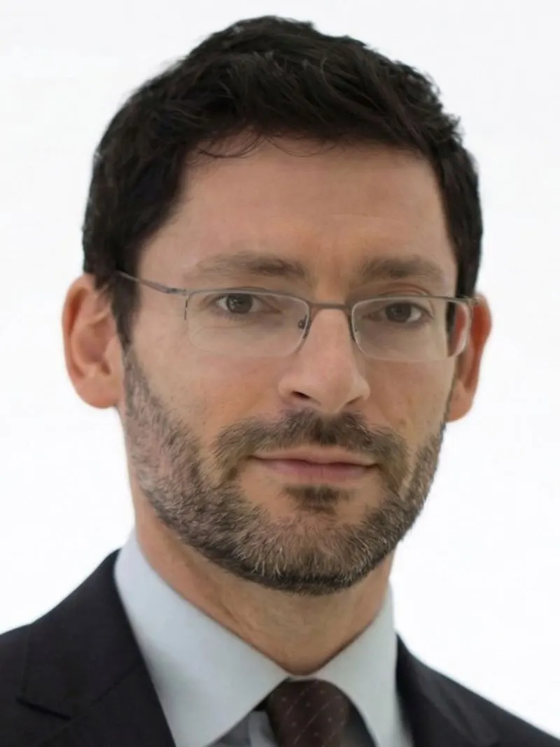 Man with glasses smiling